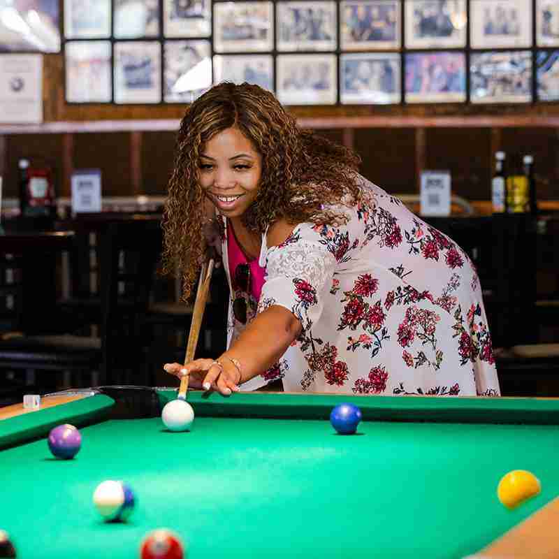Woman playing pool